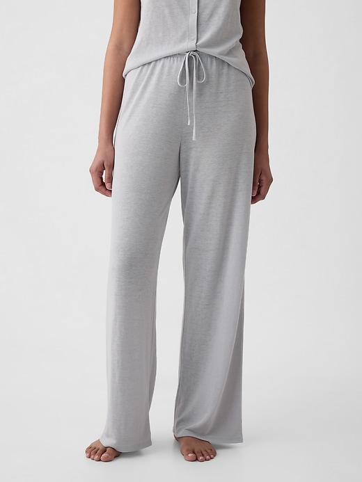 A woman wearing grey linen pajama pants