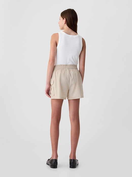 2 of 8 showing, with the color bedrock khaki of product Kids Mid Rise Cargo Shorts