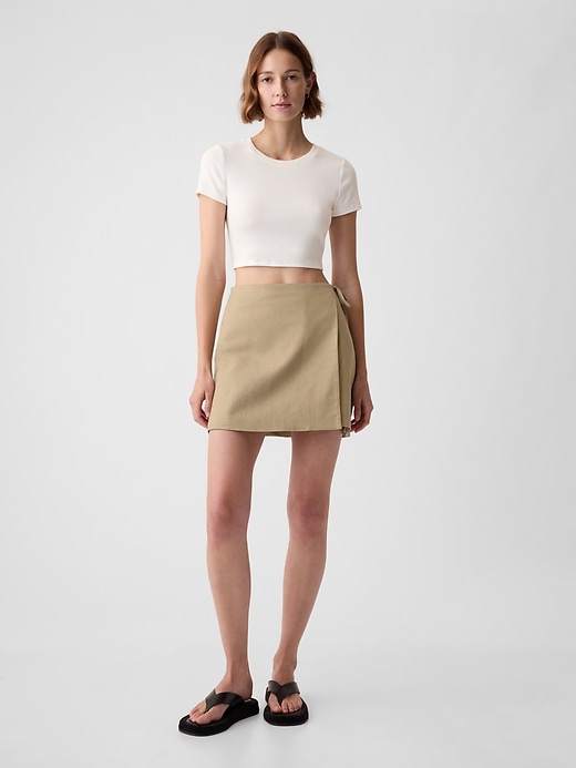 1 of 8 showing, with the color iconic khaki tan of product Linen-Cotton Wrap Mini Skirt