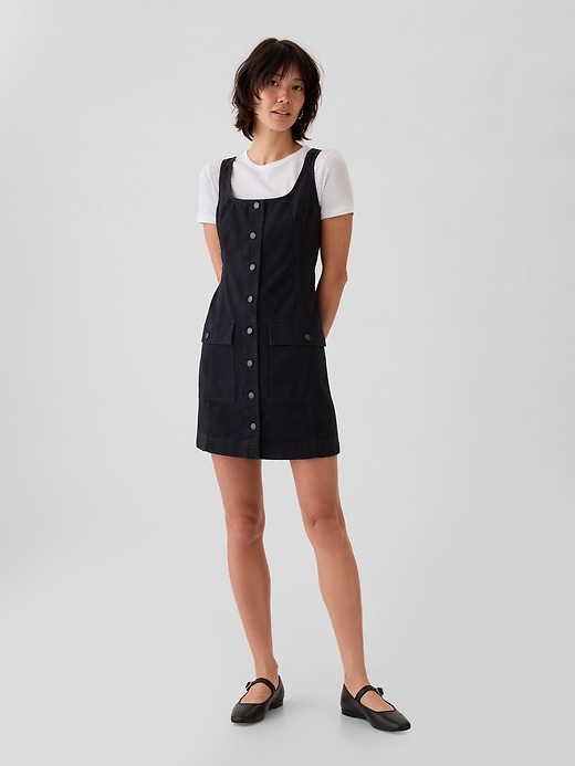 1 of 8 showing, with the color black of product Utility Button Mini Dress