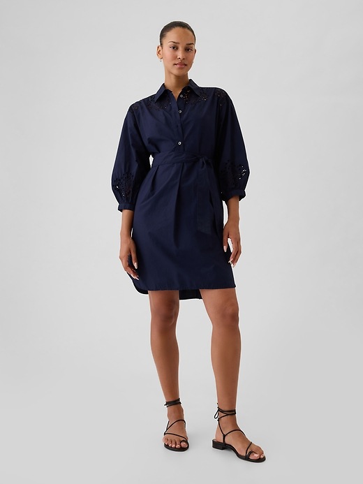 1 of 8 showing, with the color navy blue of product Eyelet Mini Shirtdress
