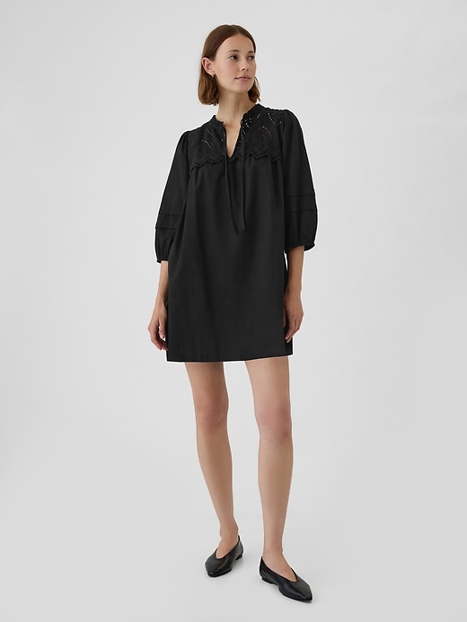 1 of 8 showing, with the color black of product Eyelet Mini Dress