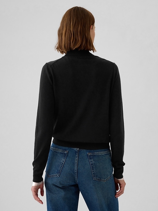 2 of 8 showing, with the color black of product Merino Turtleneck Sweater