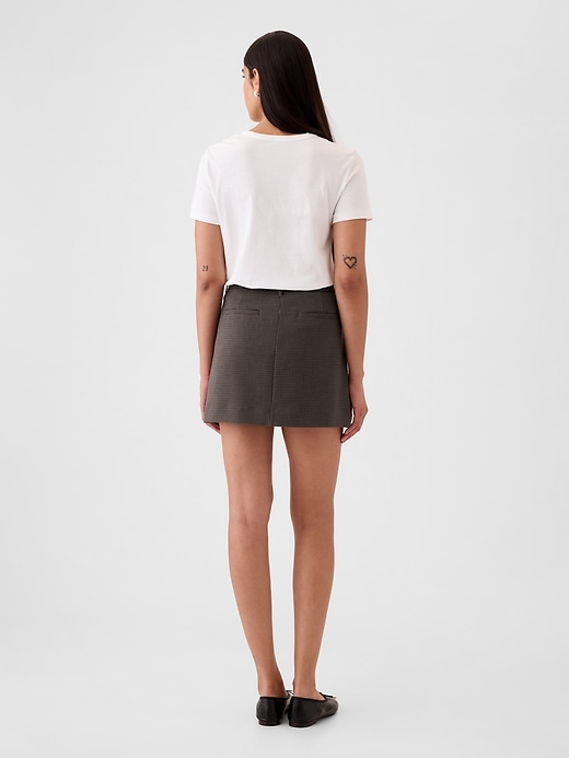 2 of 8 showing, with the color brown and black plaid of product Mini Skirt