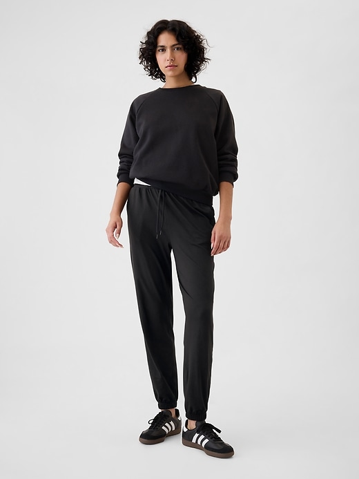 1 of 8 showing, with the color true black of product GapFit Lightweight Brushed Jersey Joggers