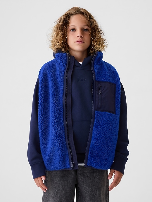 1 of 8 showing, with the color bente blue of product Kids Sherpa Vest