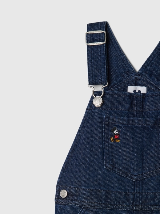 3 of 8 showing, with the color dark wash of product Gap × Disney Baby Mickey Mouse Embroidered Denim Overalls