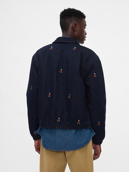 2 of 8 showing, with the color dark wash of product Gap × Disney Embroidered Denim Bomber Jacket