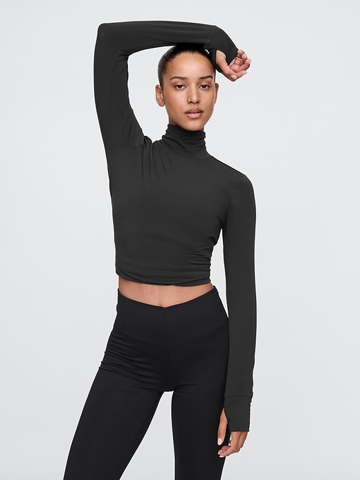 1 of 8 showing, with the color true black of product GapFit Breathe Turtleneck