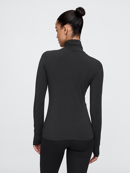 2 of 8 showing, with the color true black of product GapFit Breathe Turtleneck