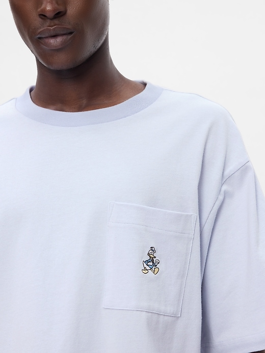 4 of 8 showing, with the color Donald Duck jet stream blue of product Gap × Disney Heavyweight Pocket T-Shirt
