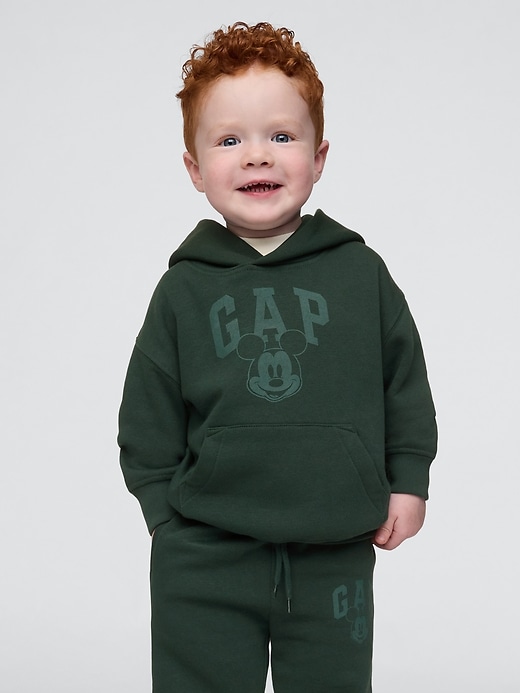 1 of 8 showing, with the color essex green of product Gap × Disney Baby Vintage Soft Mickey Mouse Logo Hoodie