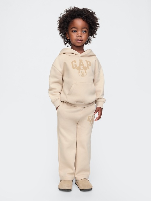 1 of 8 showing, with the color bedrock beige of product Gap × Disney Baby Vintage Soft Mickey Mouse Logo Sweatpants