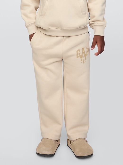 3 of 8 showing, with the color bedrock beige of product Gap × Disney Baby Vintage Soft Mickey Mouse Logo Sweatpants