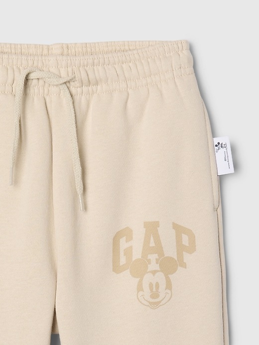 4 of 8 showing, with the color bedrock beige of product Gap × Disney Baby Vintage Soft Mickey Mouse Logo Sweatpants