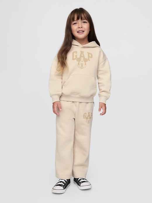 5 of 8 showing, with the color bedrock beige of product Gap × Disney Baby Vintage Soft Mickey Mouse Logo Sweatpants