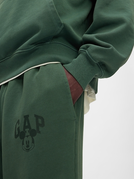 5 of 8 showing, with the color essex green of product Gap × Disney Logo Baggy Sweatpants