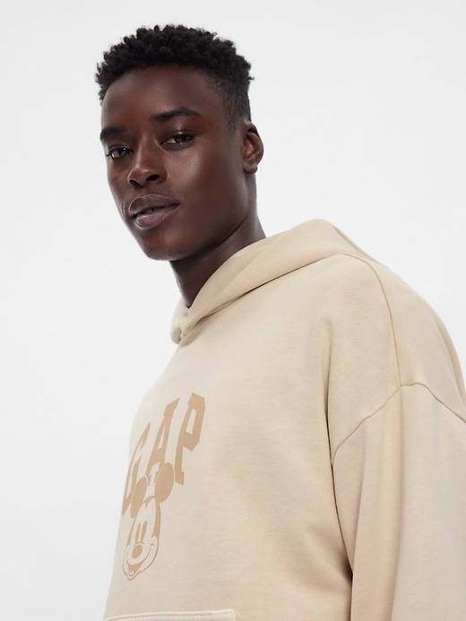 5 of 8 showing, with the color bedrock beige of product Gap × Disney Mickey Mouse Logo Hoodie