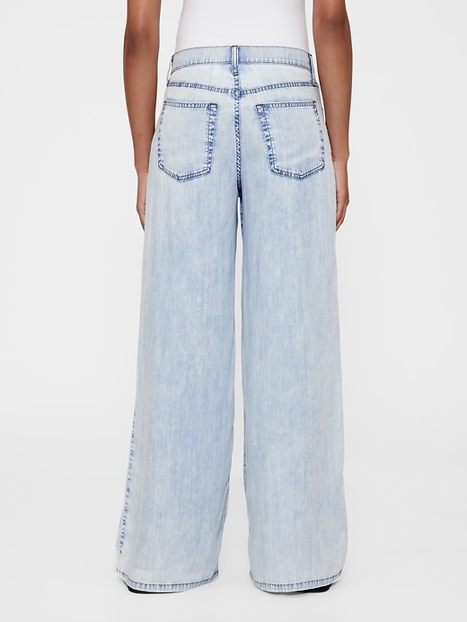 6 of 8 showing, with the color Light indigo of product GapStudio Mid Rise Draped Denim Baggy Jeans