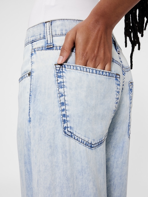 4 of 8 showing, with the color Light indigo of product GapStudio Mid Rise Draped Denim Baggy Jeans